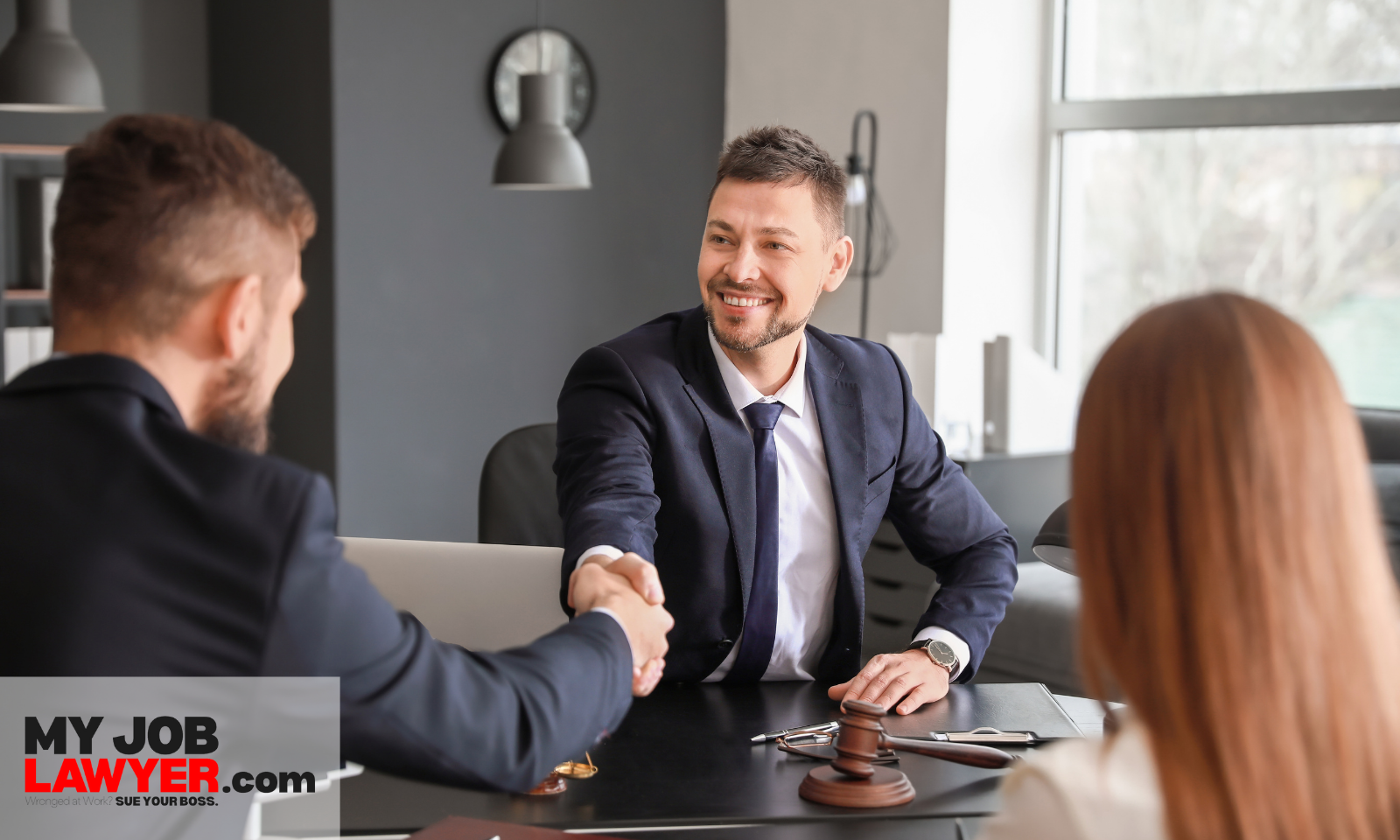 Lawyer advising clients about How Much Can I Sue My Employer for False Promises? and possible compensation.