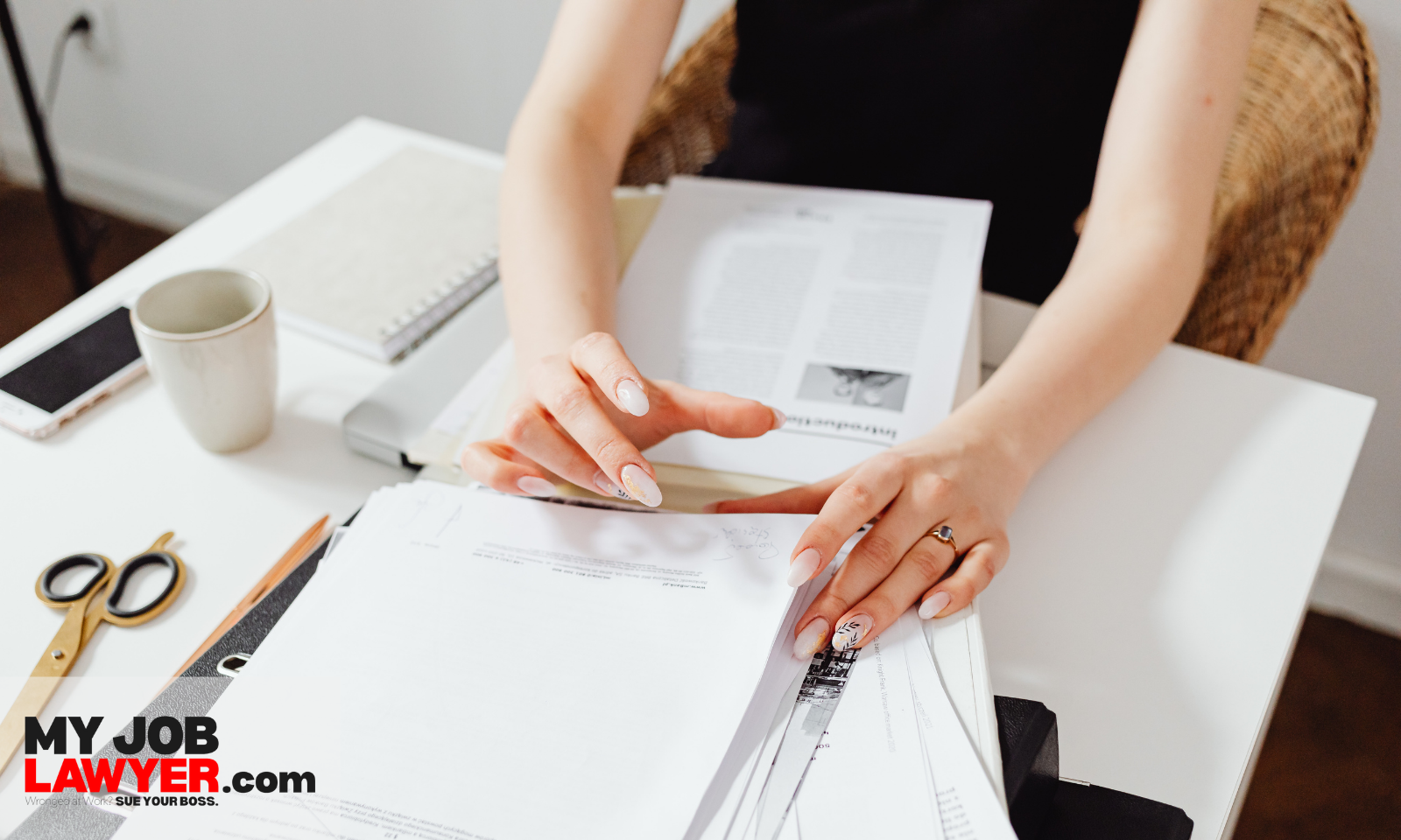 Employee gathering documents needed to prove How Much Can I Sue My Employer for False Promises?